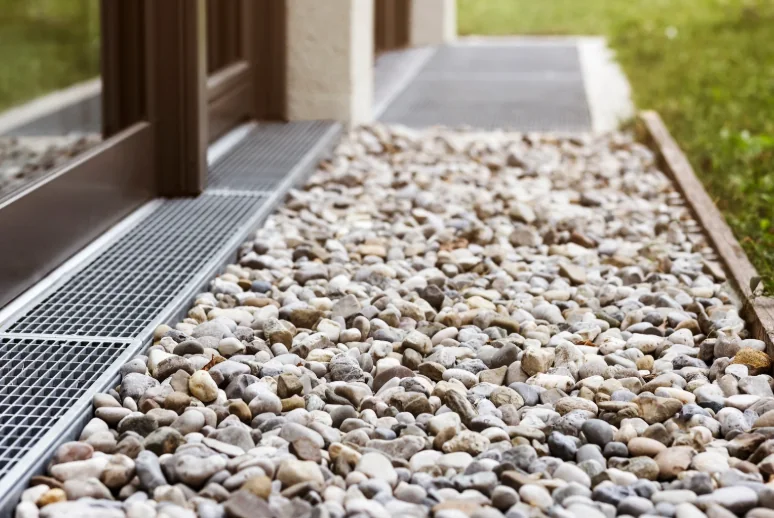 French drain installation with gravel-filled drainage trench — Charlottesville VA